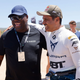 A photo of DJ Carl Cox with a racing driver in the Extreme E paddock.